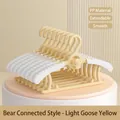 Retractable light yellow baby clothes hangers featuring a cute bear design for nursery - Stackable Telescopic Bear Style / 10 Pieces Pack / Lemon Yellow