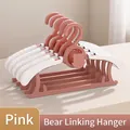 Space-saving pink children's clothes hangers with cute bear design and cascading hooks - Thickened Telescopic Bear Hanger / 10 Pieces Pack / Pink