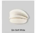 Detailed view of a soft cream white wool newsboy cap for women featuring minimalist French style - M (56-58cm) / Off White