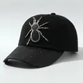 Close-up detail of black hip-hop baseball cap with spider embroidery and glitter brim - M (56-58cm) / Spider