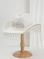 Detailed view of a white felt cowboy hat featuring 'Bride' pearl letters and tassels. - White Artificial Pearl Bride Tassel