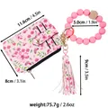 Detailed view of floral card holder with pink silicone wristlet and dimensions - Pink