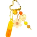 Llavero de silicona amarillo con juguete pop-it y amuleto de flor para el alivio del estrés. - Amarillo