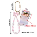 Pink beaded wristlet keychain with mini transparent floral photo album and dimensions label - Pink