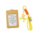 Detailed view of khaki ID card holder with yellow balloon dog and orange braided keychain. - Yellow