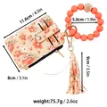Orange floral print leather card holder with silicone bead wristlet strap and tassel - Orange