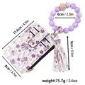 Purple floral card holder wallet with silicone bead wristlet and tassel, weight 75.7g - Purple