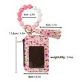 Floral Kartenetui aus Leder mit rosa Silikonperlen-Armband und Quastenanhänger. - Rosa