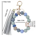 Silikonperlen-Armband Schlüsselanhänger mit grauem PU-Lederquast und Bibelkreuz-Anhänger. - Perlenketten-Stil / Saphirblau