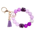 Purple silicone bead wristlet keychain featuring acrylic stones and a tassel charm. - Purple