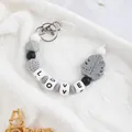 Handmade silicone leaf keychain with LOVE alphabet beads in grey and white tones - Gray