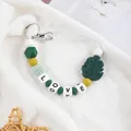 Handmade silicone leaf and LOVE letter beaded keychain in shades of green and yellow - Dark Green