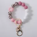 Elegant pink daisy silicone beaded keychain wristlet with floral print beads and gold ring - Pink