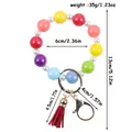 Colorful macaron silicone bead keychain bracelet with red tassel and gold lobster clasp. - Colorful