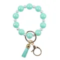 Elegant mint green silicone bead keychain bracelet with white pearls and tassels - Emerald Green