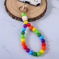 Cinturino per telefono in perline di silicone colorate con dettaglio di perla in legno geometrica - Colorato
