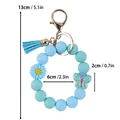 Blue silicone bead keychain wristlet with daisy and butterfly charms and tassel - Silicone Bead Wristlet Keychain / Blue