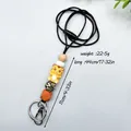 Yellow silicone beaded tiger charm lanyard necklace with black cord and metal clasp - Tiger