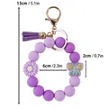 Purple silicone bead wristlet keychain with leather tassel and daisy flower charm - Silicone Bead Wristlet Keychain / Purple