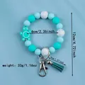 Cute blue silicone beaded keychain bracelet with turtle charm, tassel, and measurements - Malachite green