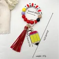 Colorful silicone bead wristlet keychain with pencil charm and red tassel, 21cm length - Red