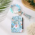 Blaue Leder-Kartentasche mit Gänseblümchen-Print, Perlenarmband und Quasten-Anhänger - Azurblau
