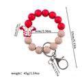 Red silicone beaded football jersey keychain wristlet with dimension and weight info. - Red