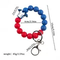 Sporty red and blue silicone bead keychain wristlet with football jersey charm detail. - Blue