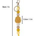 Yellow silicone leaf beaded keychain with wooden beads and size markings, 18cm long - Yellow