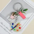 Artistic acrylic keychain featuring mini paint palette ruler and pencil cup charms - Lotus Pink