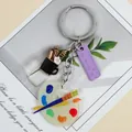Creative artist theme acrylic keychain featuring a mini paint palette and ruler pendant - Purple