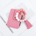 Pink silicone bead keychain featuring PU leather card holder and elegant tassel charm accessory - Pink