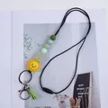 Cordón llavero hecho a mano con cuentas de silicona y sol de dibujos animados verde - Arco Iris Verde Matcha