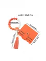 Orange PU leather card holder featuring a silicone beaded wristlet and elegant tassel. - Orange Red