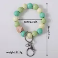 Green and cream wooden bead bracelet keychain with lobster clasp and metal ring - Light Green