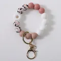 Daisy flower silicone bead wristlet keychain featuring pink and white abstract printed beads - White