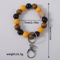 Wooden beaded keychain bracelet with multicolor beads, 7cm diameter and 31.5g weight - Cat's Eye Effect