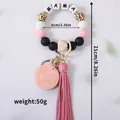 Roze siliconen kralen sleutelhanger met MAMA-letters en kwastje, lengte 21 cm - Roze