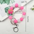 Leuchtendes Schlüsselanhänger-Armband aus Silikonperlen in Rosa und Weiß - Schmetterling Anhänger (K-1643) / Rosa