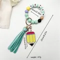 Silicone beaded keychain wristlet with 'TEACH' letters and tassel pencil charm - Emerald Green