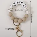 Porte-clés bracelet en perles de silicone avec lettres MAMA en kaki et blanc crème. - Kaki
