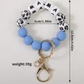Porte-clés bracelet en perles de silicone bleu avec lettres MAMA et motif vache - Bleu saphir
