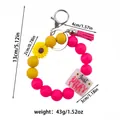Pink and yellow silicone bead keychain bracelet with sunflower and tassel detail - Bead Chain Style / Rose Red Ring