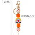 Rainbow Teacher silicone keychain charm with orange and checkered beads for bag hanging - Orange