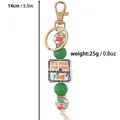 Silicone bead keychain with IT'S FINE plaque and gold clasp, green and patterned beads - Green