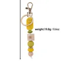 Handmade yellow rose silicone and wooden bead keychain with butterfly engraving, 19.8g - Yellow