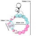 Cute pink and blue silicone beaded bracelet keychain with a cartoon coffee cup charm - Wristband Style / Light Blue