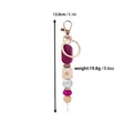 Handmade rose patterned silicone and wooden bead keychain with gold lobster clasp hardware - Magenta