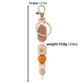 Handmade silicone and wood bead keychain with engraved rose tag in brown finish - Coffee