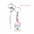 Cute silicone book character keychain with pink glasses and dimension measurements - Clasp Style / Light Blue